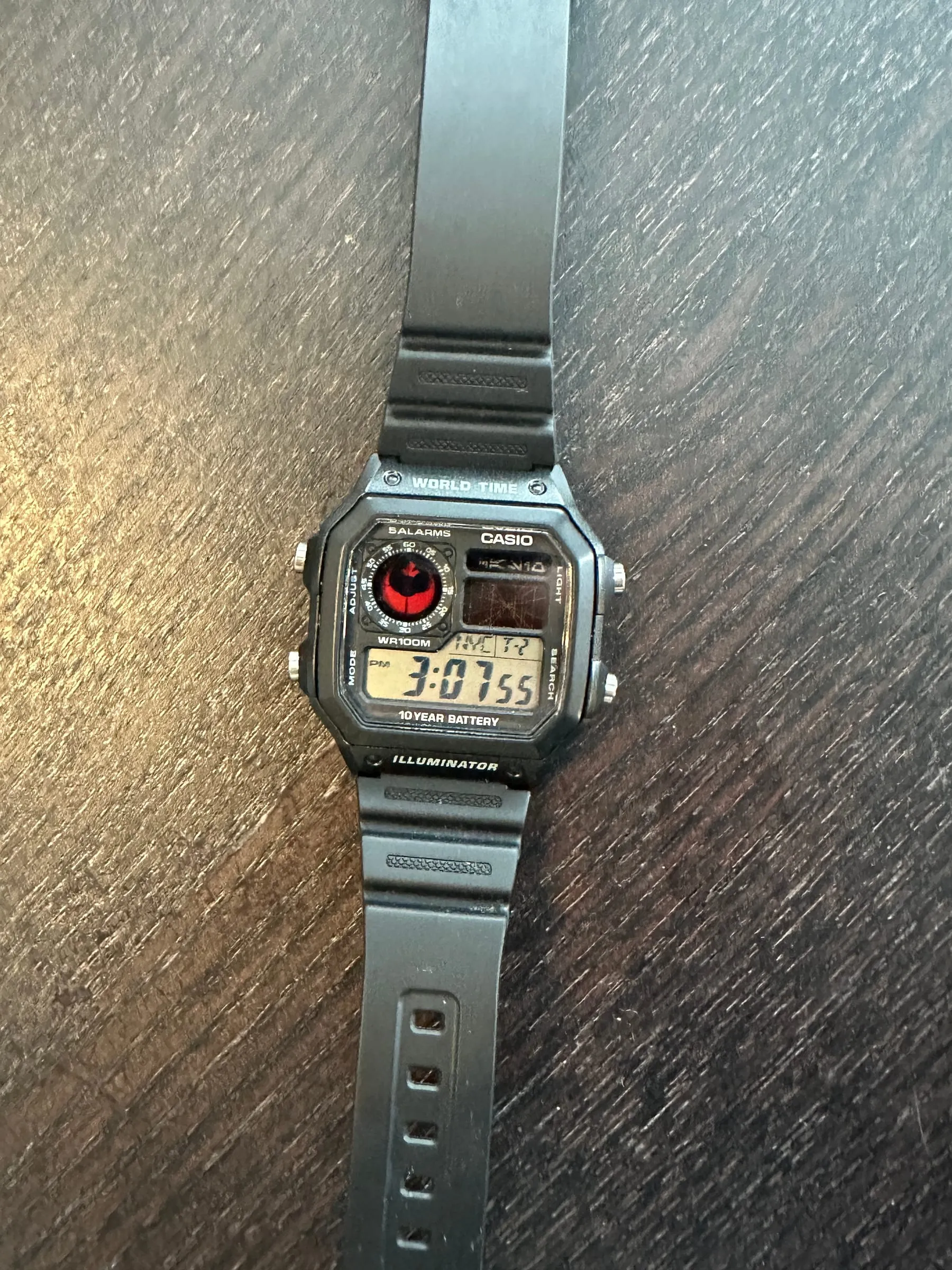 Black Casio Royale with a red-and-black custom display graphic